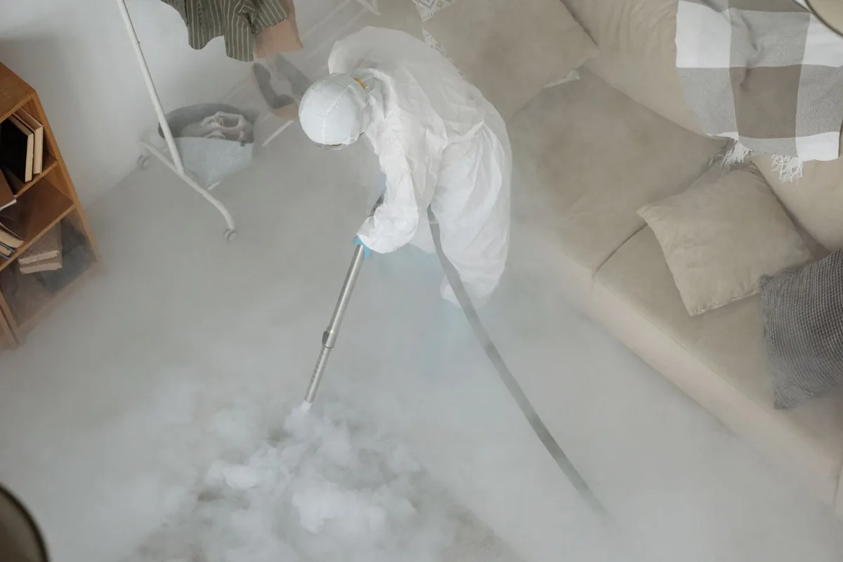Biohazard cleanup technician in protective equipment, High Desert, Albuquerque, NM
